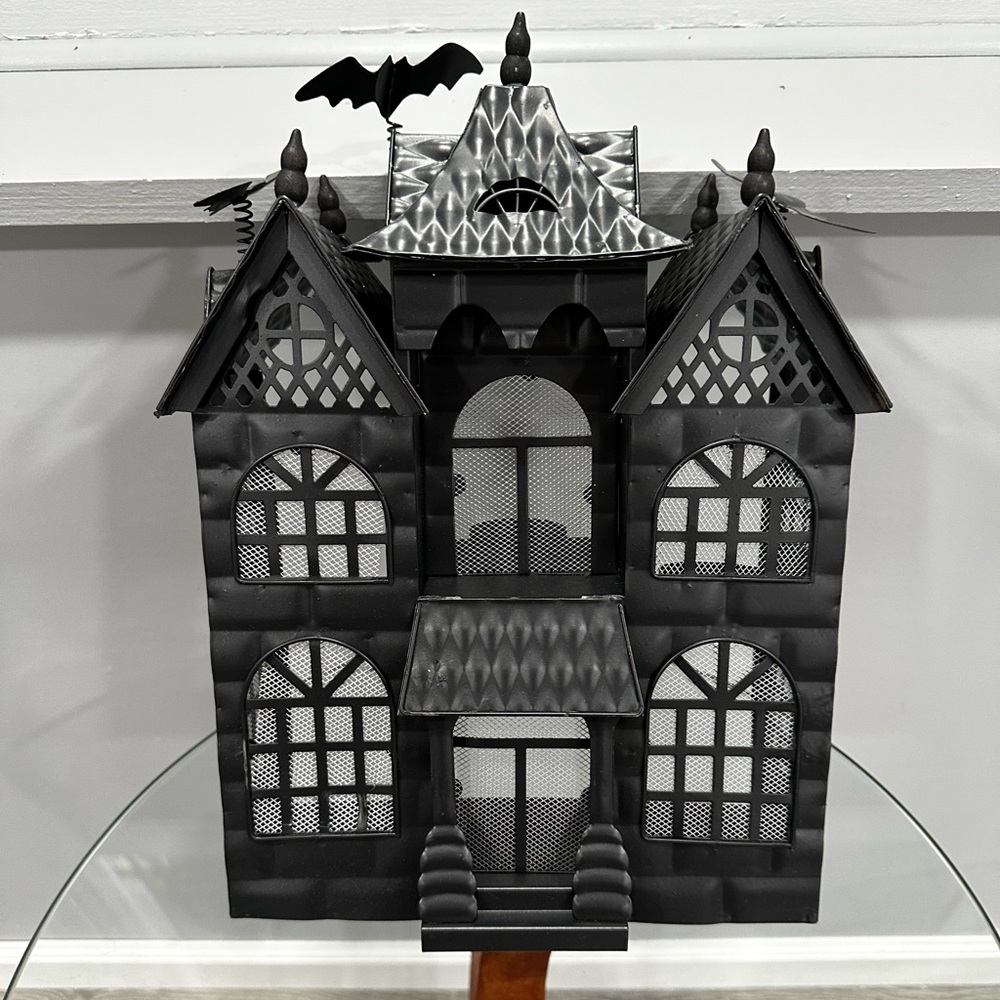 Metal haunted house tea light candle holder
